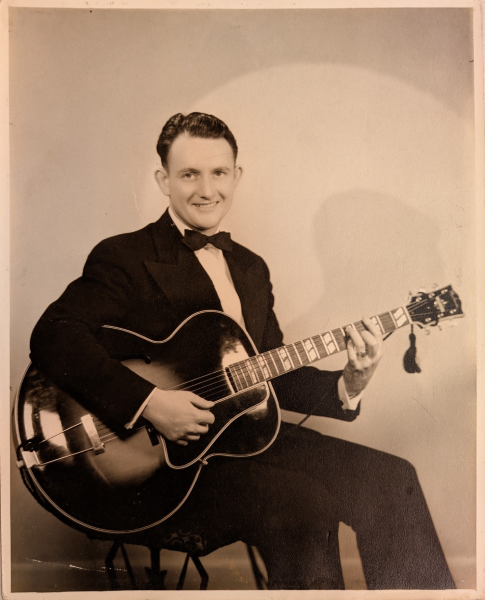 Amos Arthur poses with an archtop guitar, circa 1935, years before he and his wife, Leola, founded Arthur’s Music Store in Indianapolis.