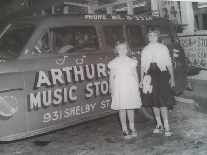 Elizabeth and Linda Arthur beside an Arthur’s Music Store vehicle, circa 1958