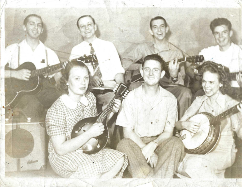 Leola Dill Arthur, holding a mandolin at front left, with Amos Arthur and fellow musicians.
