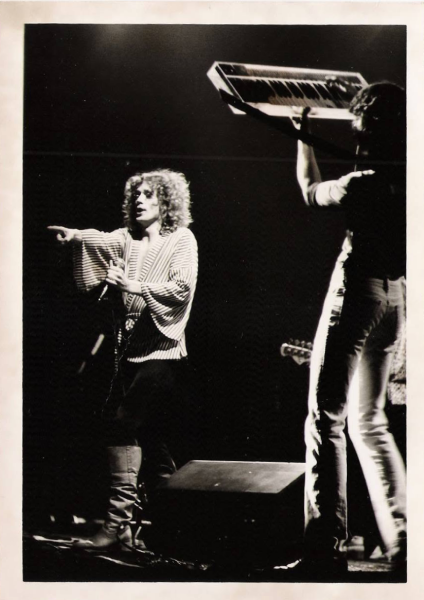 Steve “Mac” McNally and Michael Read perform with Roadmaster as Read raises his keyboard overhead. Photo courtesy of Jim Drew.