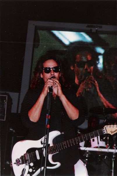 Roadmaster guitarist Rick Benick performs live with his image projected on the video screen behind him. Photo courtesy of Jim Drew.