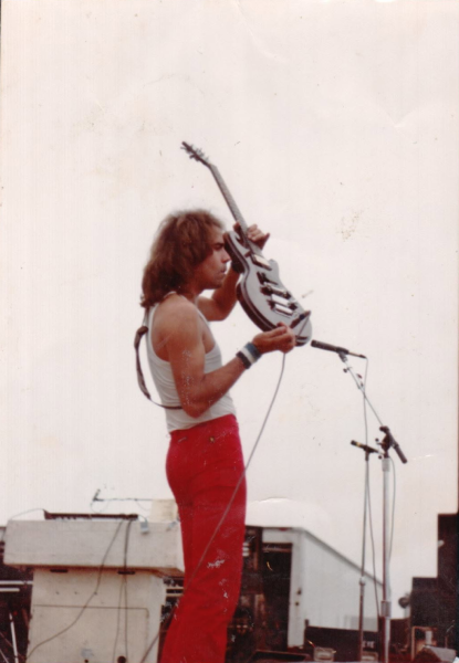 Roadmaster guitarist Rick Benick plays his “Screaming Epi Scroll” at the North Drive-In in Alexandria, Indiana, in 1981. Photo by Michael Brooks.