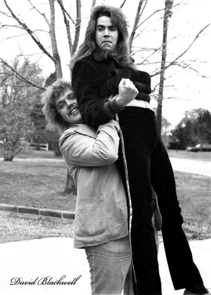 Rick Benick shares a playful moment with Steve Brooks, a roadie for the Cherry People, in Oxon Hill, Maryland. Photo by David Blackwell.